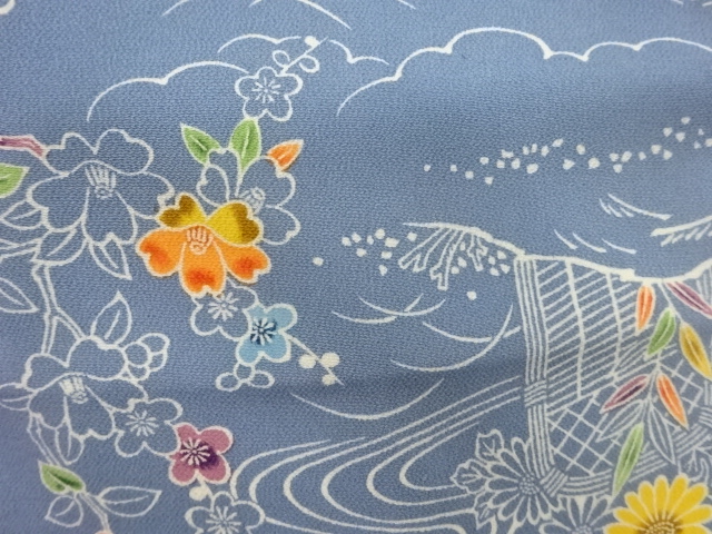  縮緬地柴垣に流水・草花模様名古屋帯